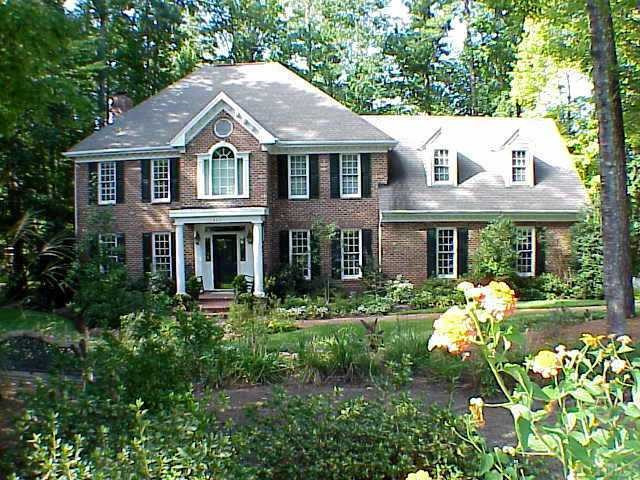 This executive home features tall, smooth ceilings, 1st floor guestroom, oversized side entrance garage w/workbench area, back staires to playrom, walk-up attic, numberous ceiling fans, intercom,security system, central vaccume and more! WOW! Exterior Front