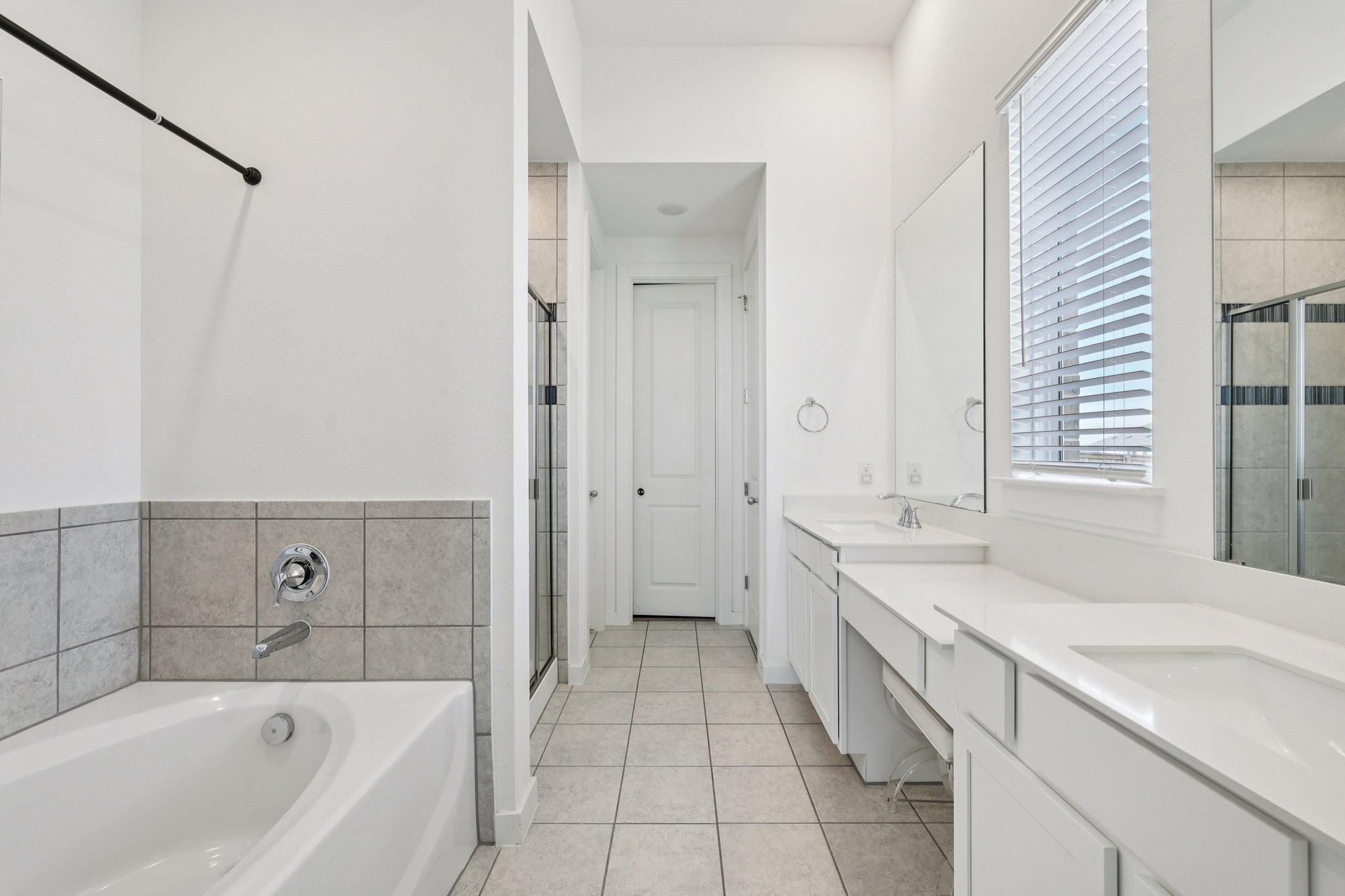 291 Billowing Way Kyle, TX 78640 - Photo 12 of 20 a spacious bathroom with a tub sink and mirror