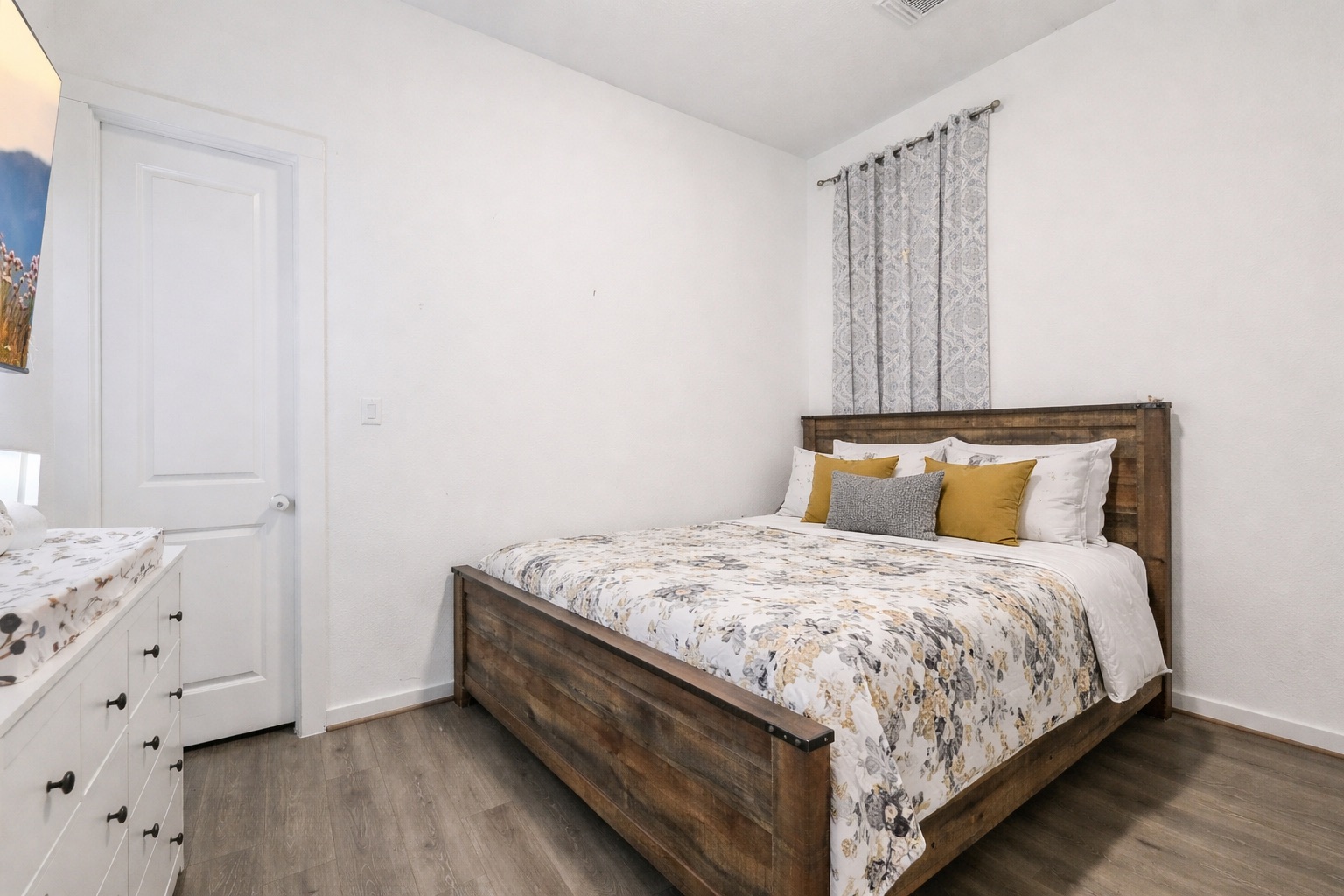 291 Billowing Way Kyle, TX 78640 - Photo 13 of 20 a bedroom with a bed and wooden floor