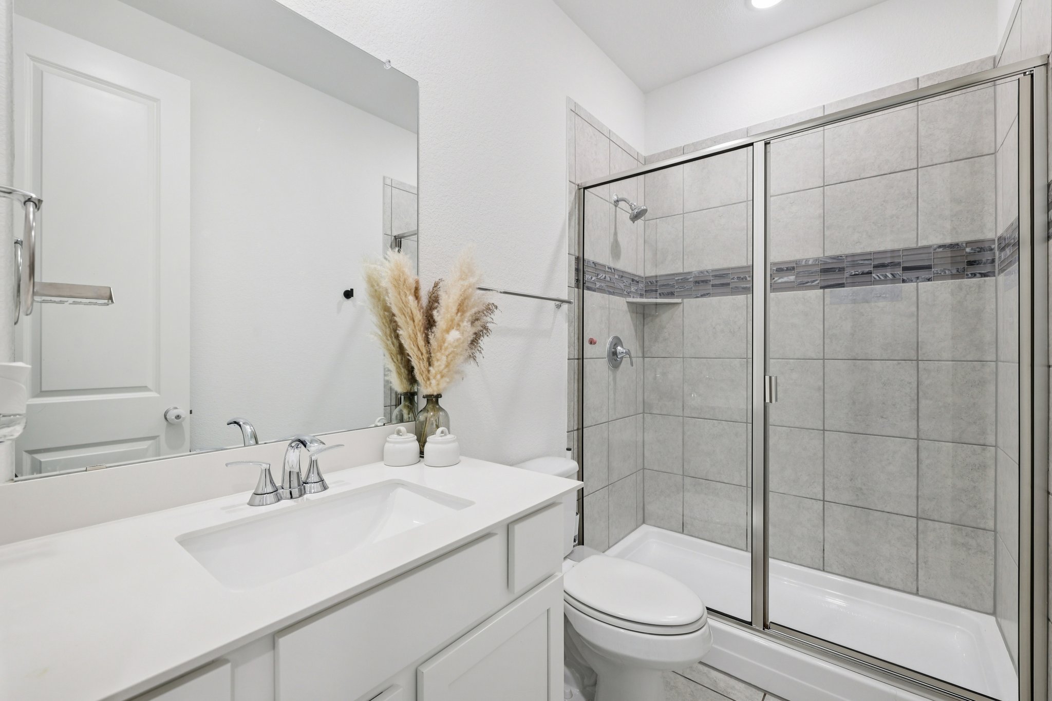 291 Billowing Way Kyle, TX 78640 - Photo 14 of 20 a bathroom with a sink toilet and shower