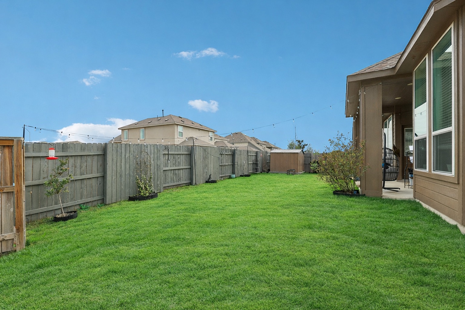 291 Billowing Way Kyle, TX 78640 - Photo 19 of 20 a view of a backyard with a garden