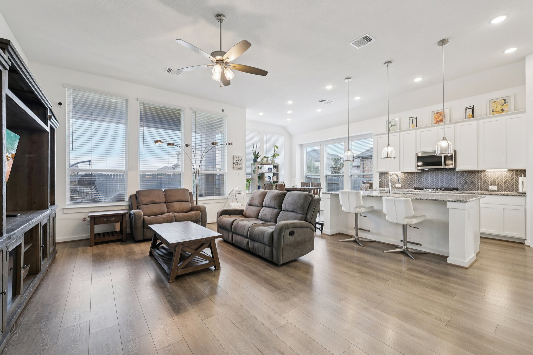 291 Billowing Way Kyle, TX 78640 - Photo 2 of 20 a living room with furniture kitchen view and a wooden floor