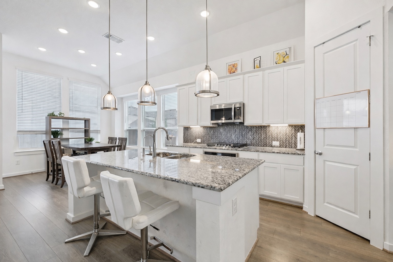 291 Billowing Way Kyle, TX 78640 - Photo 5 of 20 a kitchen with kitchen island granite countertop a table chairs sink and cabinets