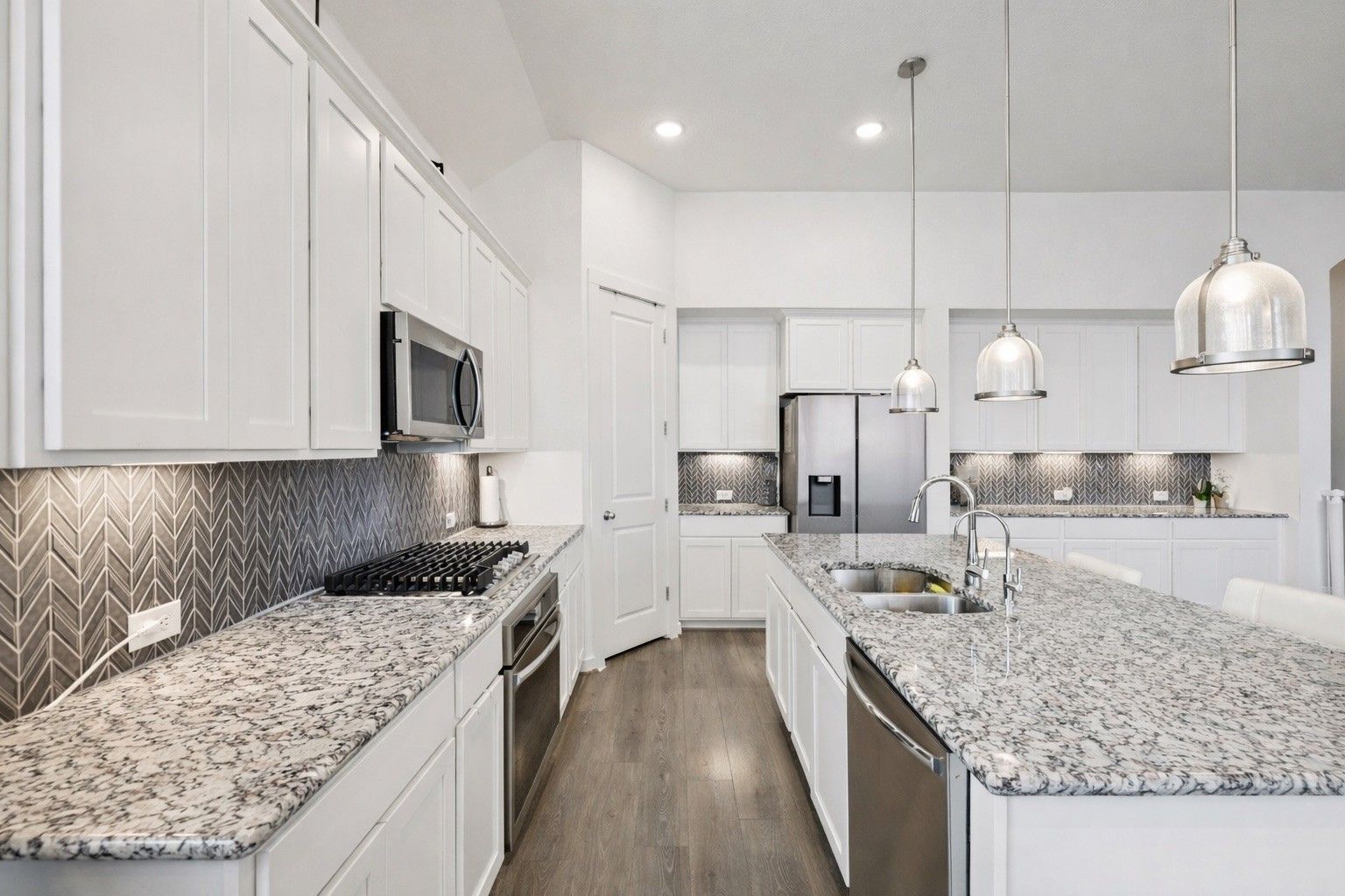 291 Billowing Way Kyle, TX 78640 - Photo 6 of 20 a kitchen with stainless steel appliances granite countertop a sink stove and refrigerator