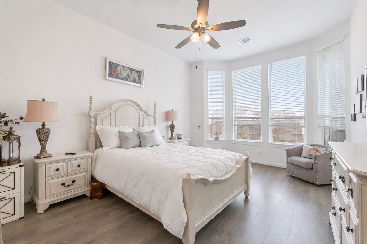 291 Billowing Way Kyle, TX 78640 - Photo 10 of 20 a bedroom with a bed and a chandelier