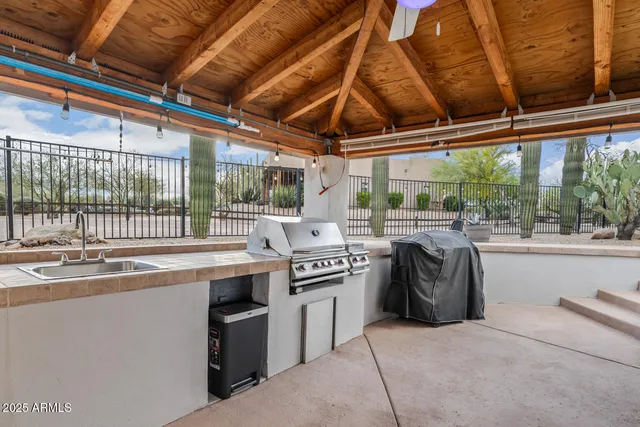 an aerial view of a house with a swimming pool and outdoor space