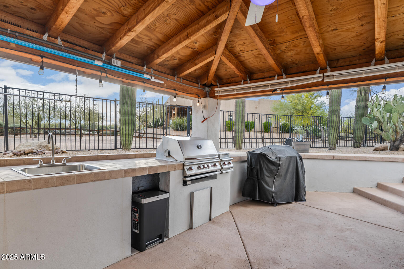 17449 East Quail Track Road Rio Verde, AZ 85263 - Photo 11 of 48 a kitchen with a stove and a sink