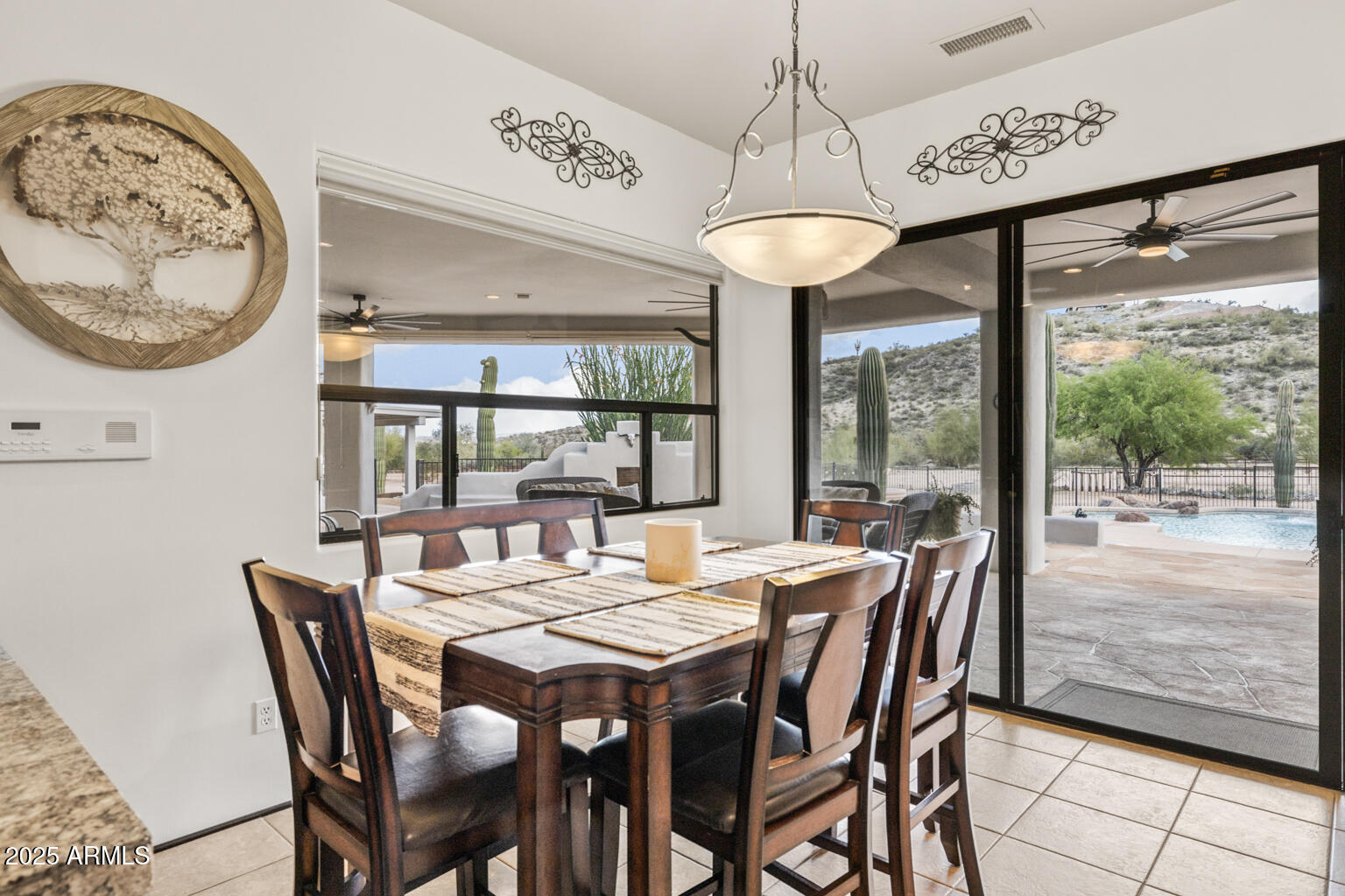 17449 East Quail Track Road Rio Verde, AZ 85263 - Photo 17 of 48 a view of a dining room with furniture window and outside view