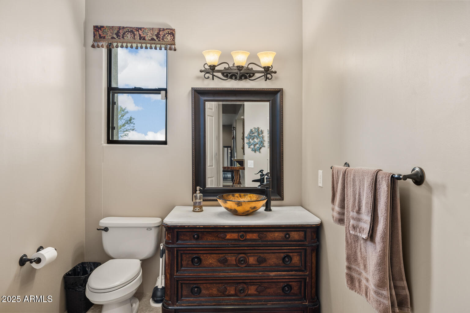 17449 East Quail Track Road Rio Verde, AZ 85263 - Photo 23 of 48 a bathroom with a toilet and a sink