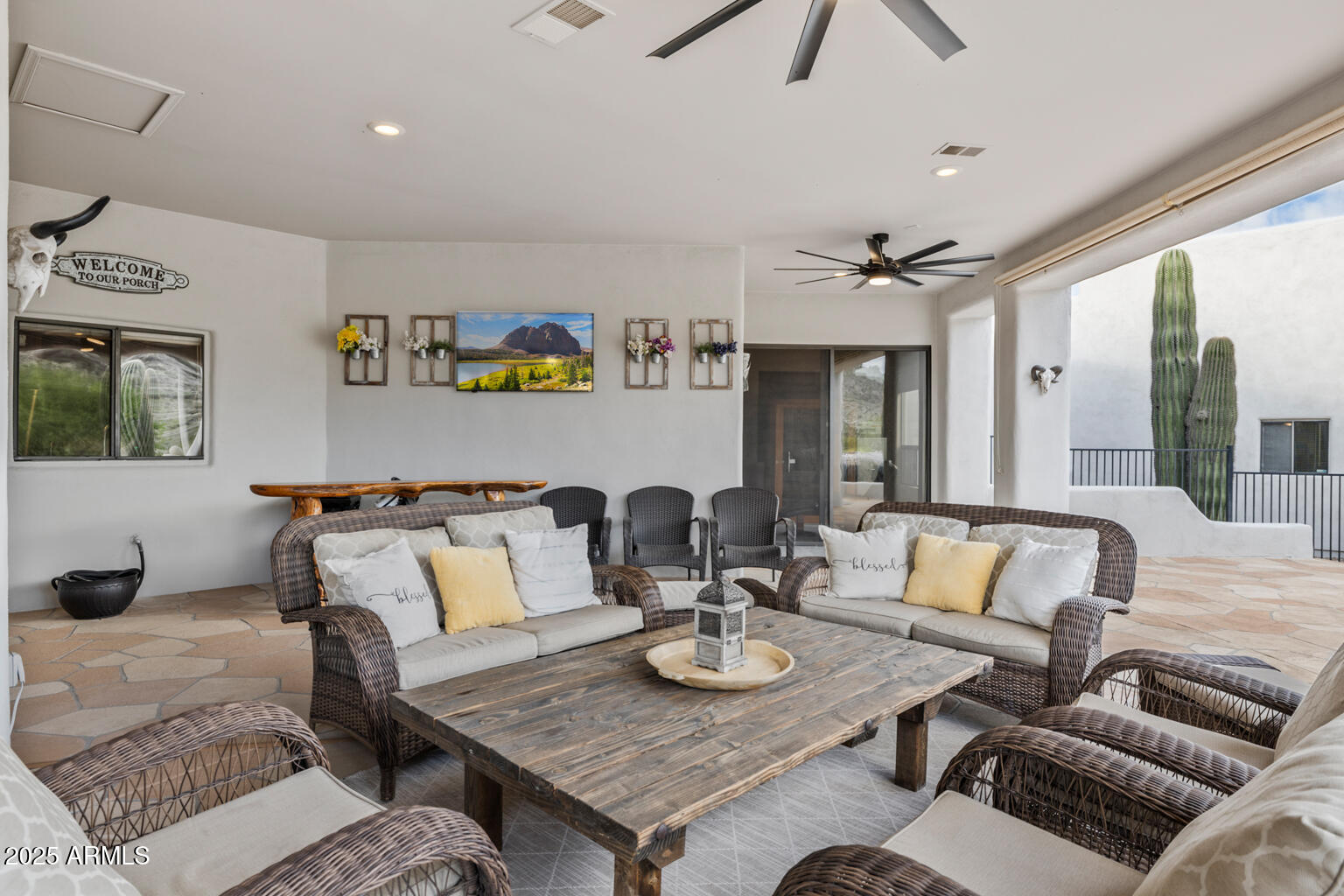 17449 East Quail Track Road Rio Verde, AZ 85263 - Photo 32 of 48 a living room with furniture and a fireplace