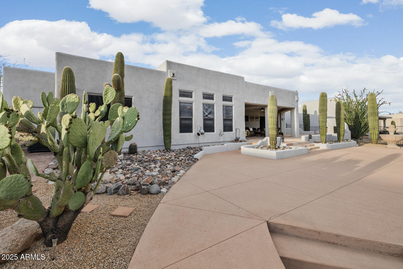 17449 East Quail Track Road Rio Verde, AZ 85263 - Photo 45 of 48 a view of a building with potted plants