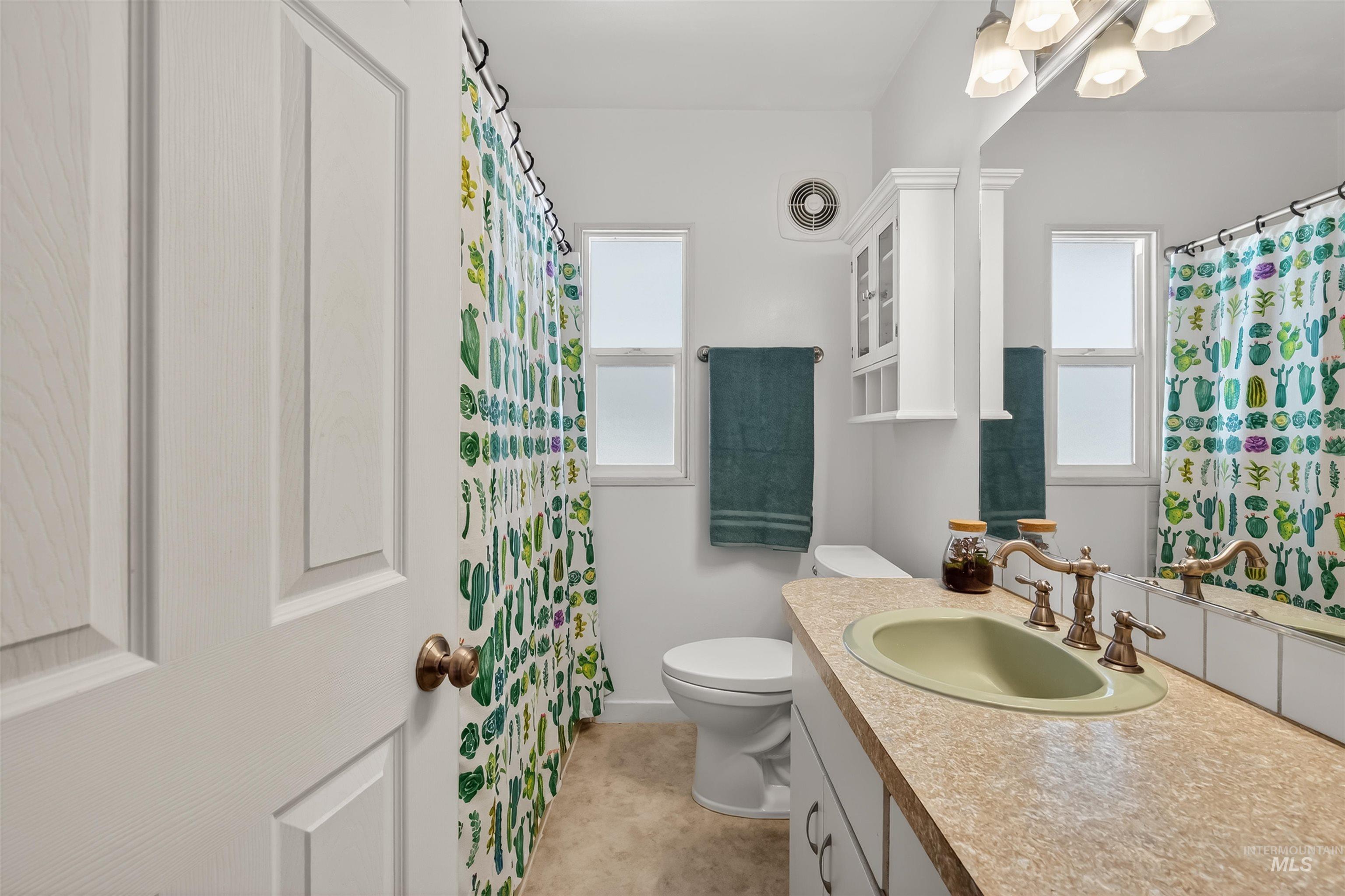 921 3rd Street Clarkston, WA 99403 - Photo 17 of 39 Bathroom with vanity and a shower with curtain