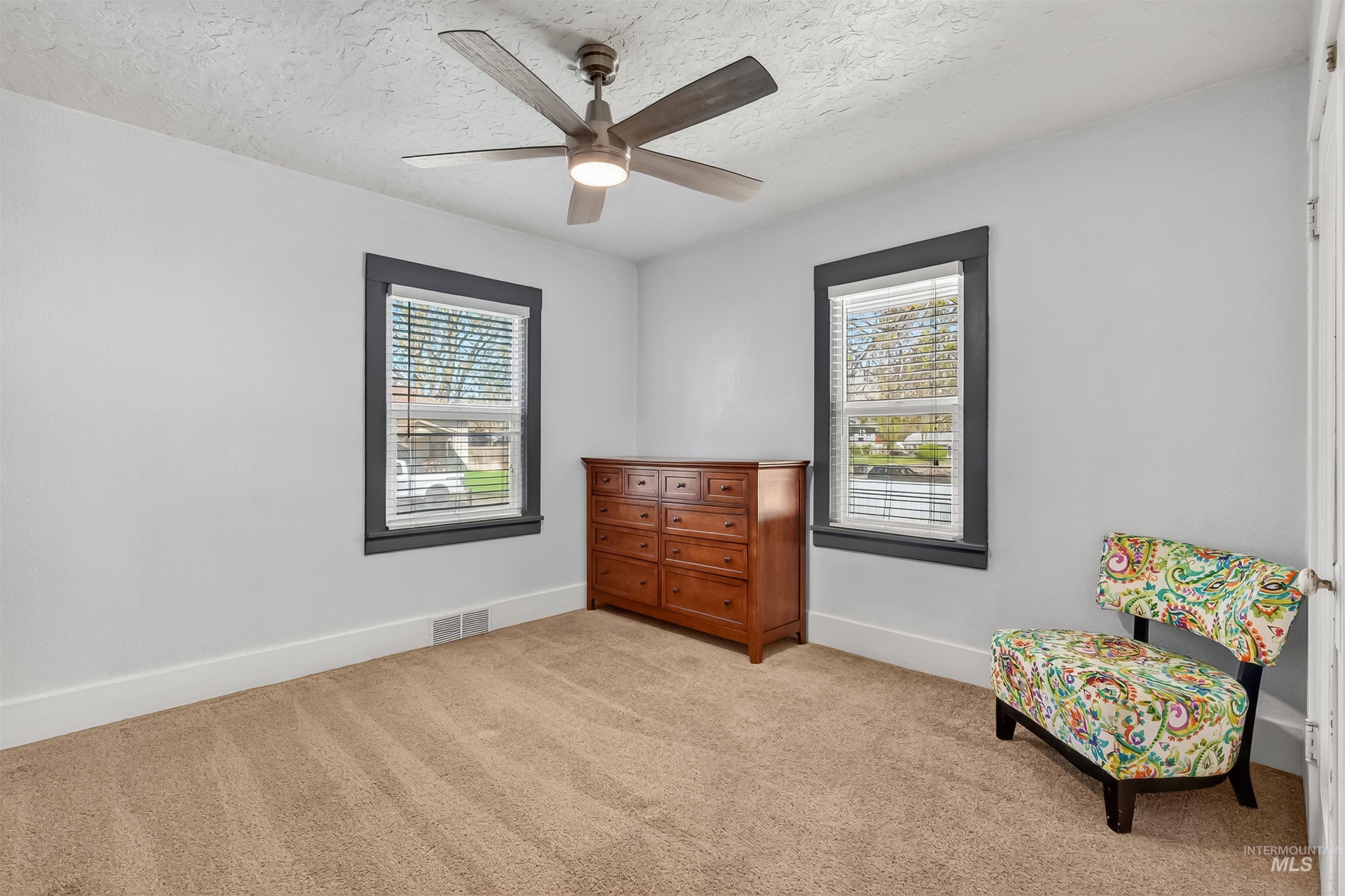 921 3rd Street Clarkston, WA 99403 - Photo 20 of 39 Sitting room with light colored carpet, a textured ceiling, and ceiling fan