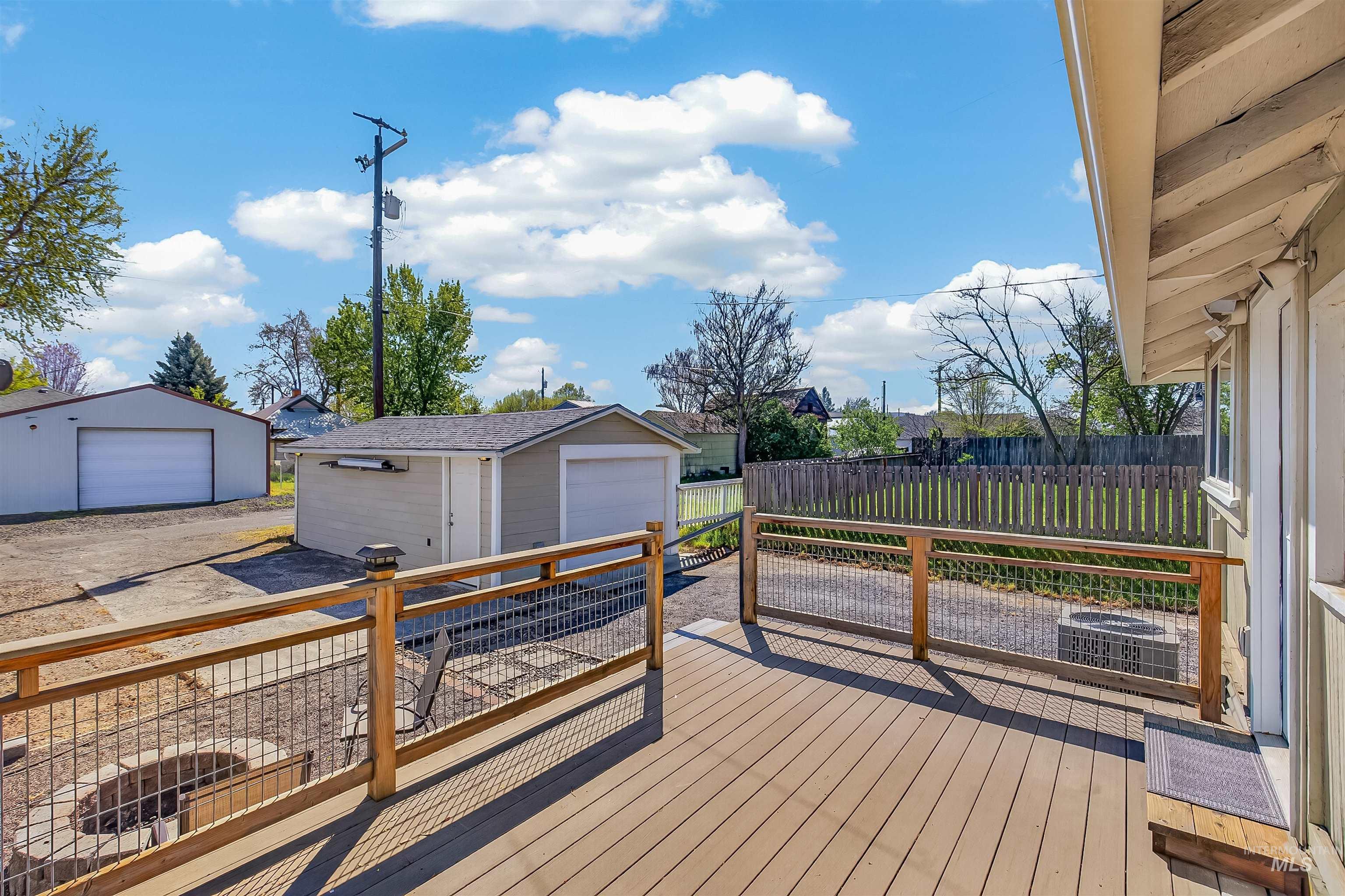 921 3rd Street Clarkston, WA 99403 - Photo 35 of 39 Deck with a detached garage, an outdoor structure, and a residential view