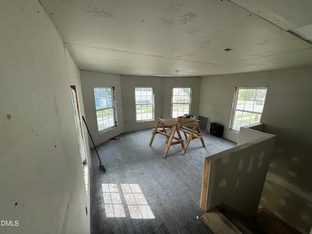a view of a livingroom with furniture and windows
