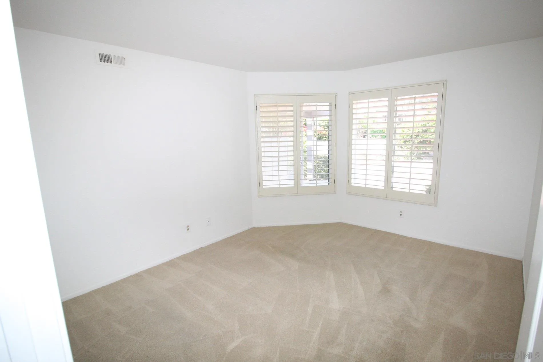 4190 Rhodes Way Oceanside, CA 92056 - Photo 14 of 25 an empty room with windows