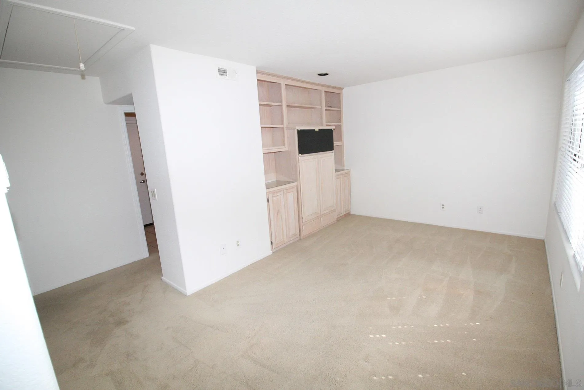 4190 Rhodes Way Oceanside, CA 92056 - Photo 18 of 25 a view of a refrigerator in kitchen and white walls