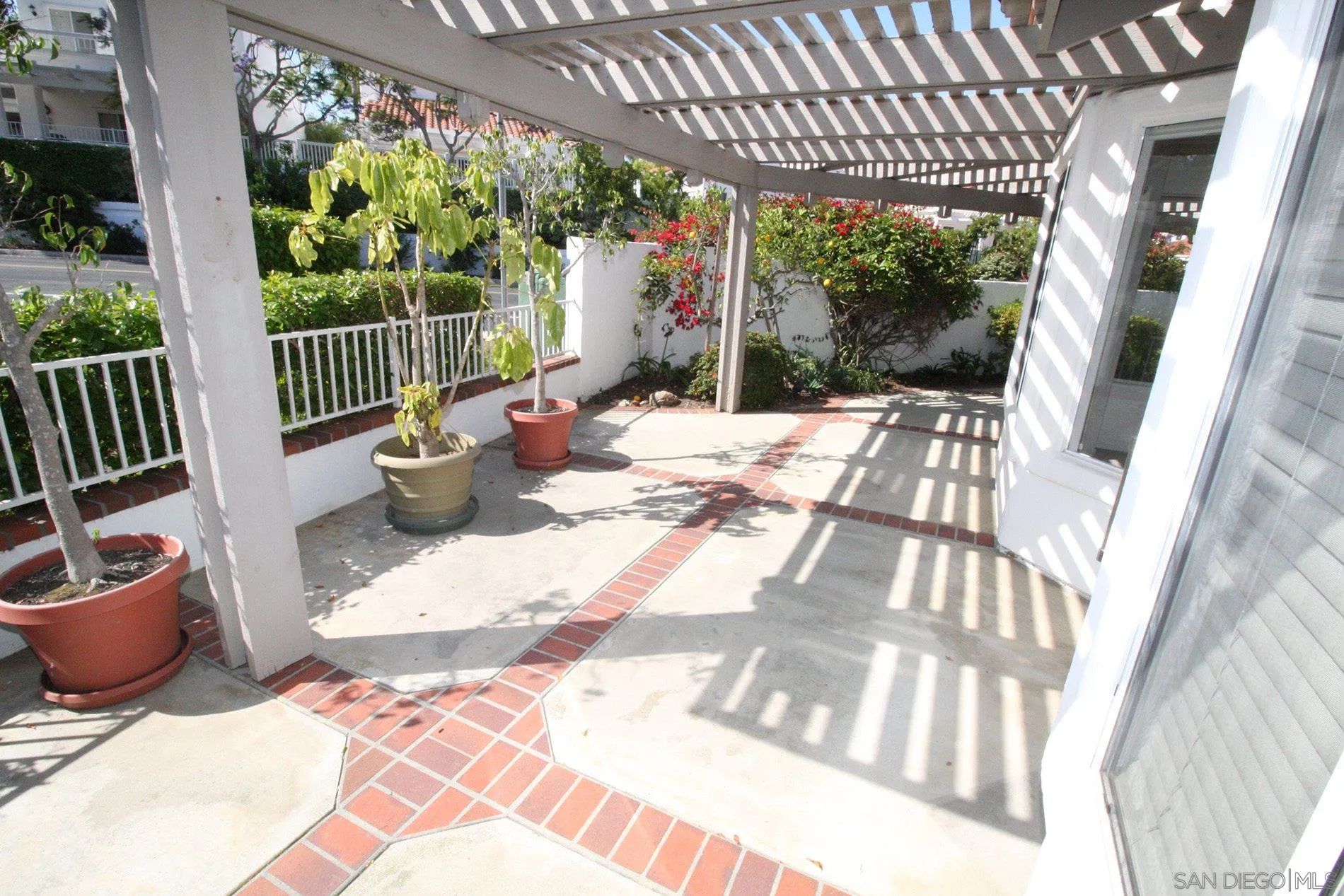 4190 Rhodes Way Oceanside, CA 92056 - Photo 5 of 25 a view of a patio with a dining table and chairs