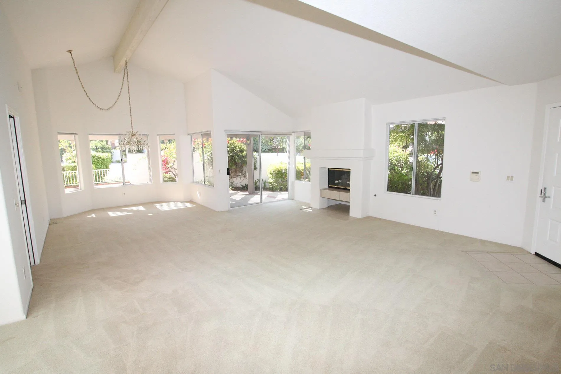 4190 Rhodes Way Oceanside, CA 92056 - Photo 6 of 25 a view of a big room with windows and chandelier