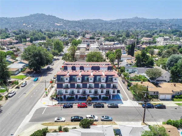 an aerial view of a house with a big yard