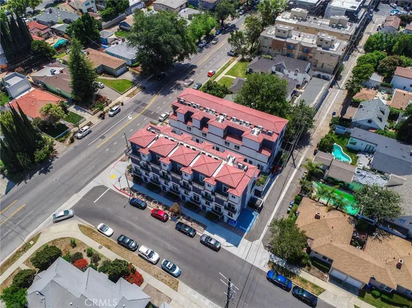 a view of a room with wooden floor and window