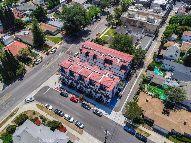 a view of a room with wooden floor and window
