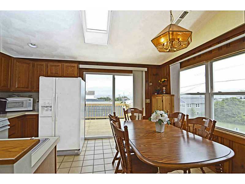23 Angell Road Narragansett, RI 02882 - Photo 13 of 20 Kitchen. Enjoy ocean views from the 2nd floor kitchen & dining area with access to the 12 x32 expansive deck.