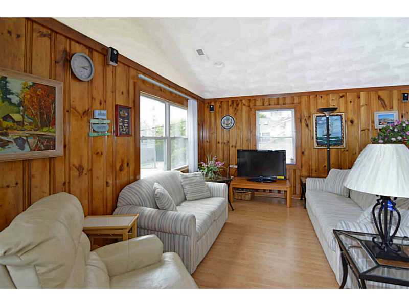23 Angell Road Narragansett, RI 02882 - Photo 14 of 20 Living Room. Living Room with 5 year young floating floor & cathedral ceiling.