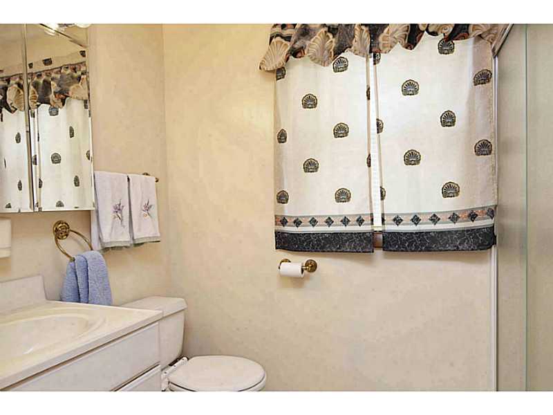 23 Angell Road Narragansett, RI 02882 - Photo 17 of 20 Bathroom. There is a 2 seat shower not completely shown on the right. The laundry is in the hallway.