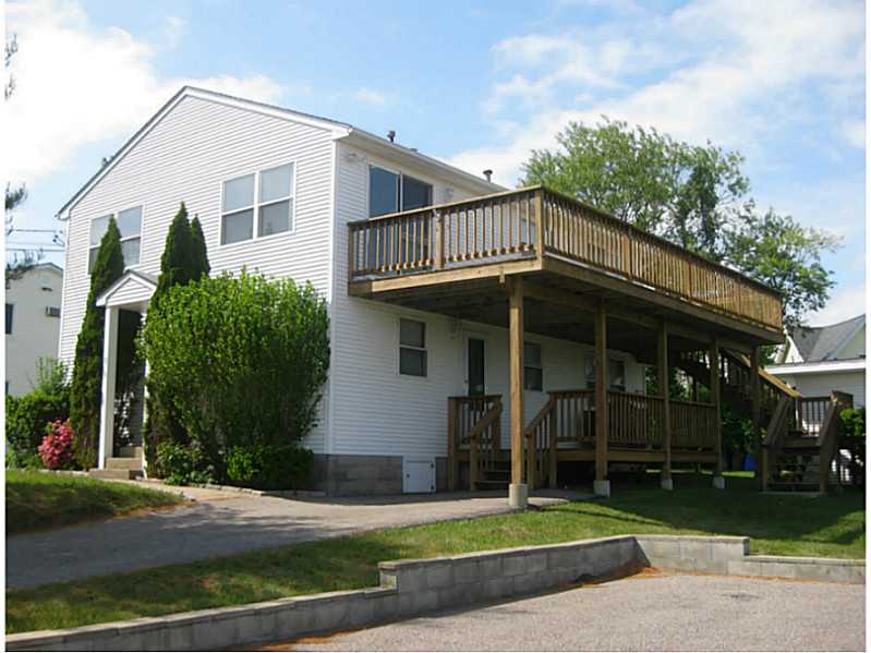 23 Angell Road Narragansett, RI 02882 - Photo 3 of 20 Exterior Front. 1996 brought a new 22 x26 2nd floor addition with new roof (since replaced in 2012), vinyl siding, new windows & doors (both levels) & 2 decks.