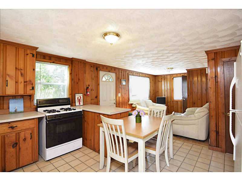 23 Angell Road Narragansett, RI 02882 - Photo 6 of 20 Kitchen. A very bright living area with newer laminate floors in the living room & tile in the kitchen area (2005).