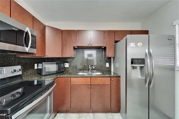 a view of balcony with wooden floor and fence