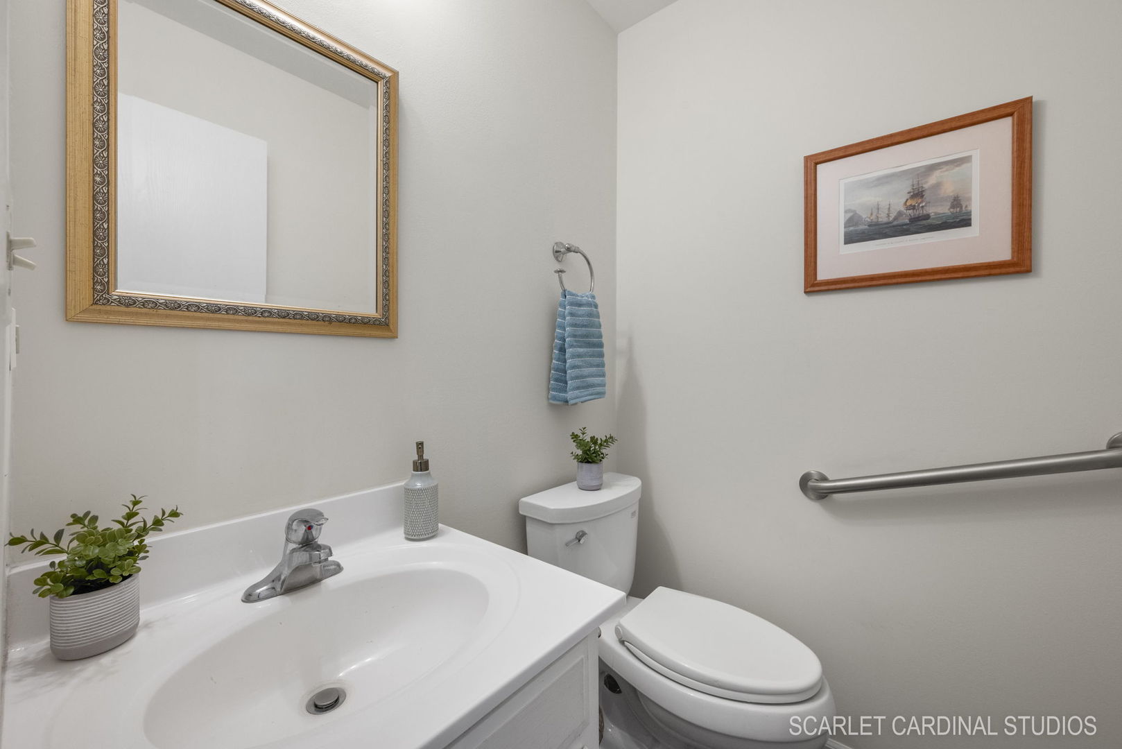 29W206 Wagner Road Naperville, IL 60564 - Photo 14 of 27 a bathroom with a toilet a sink and mirror