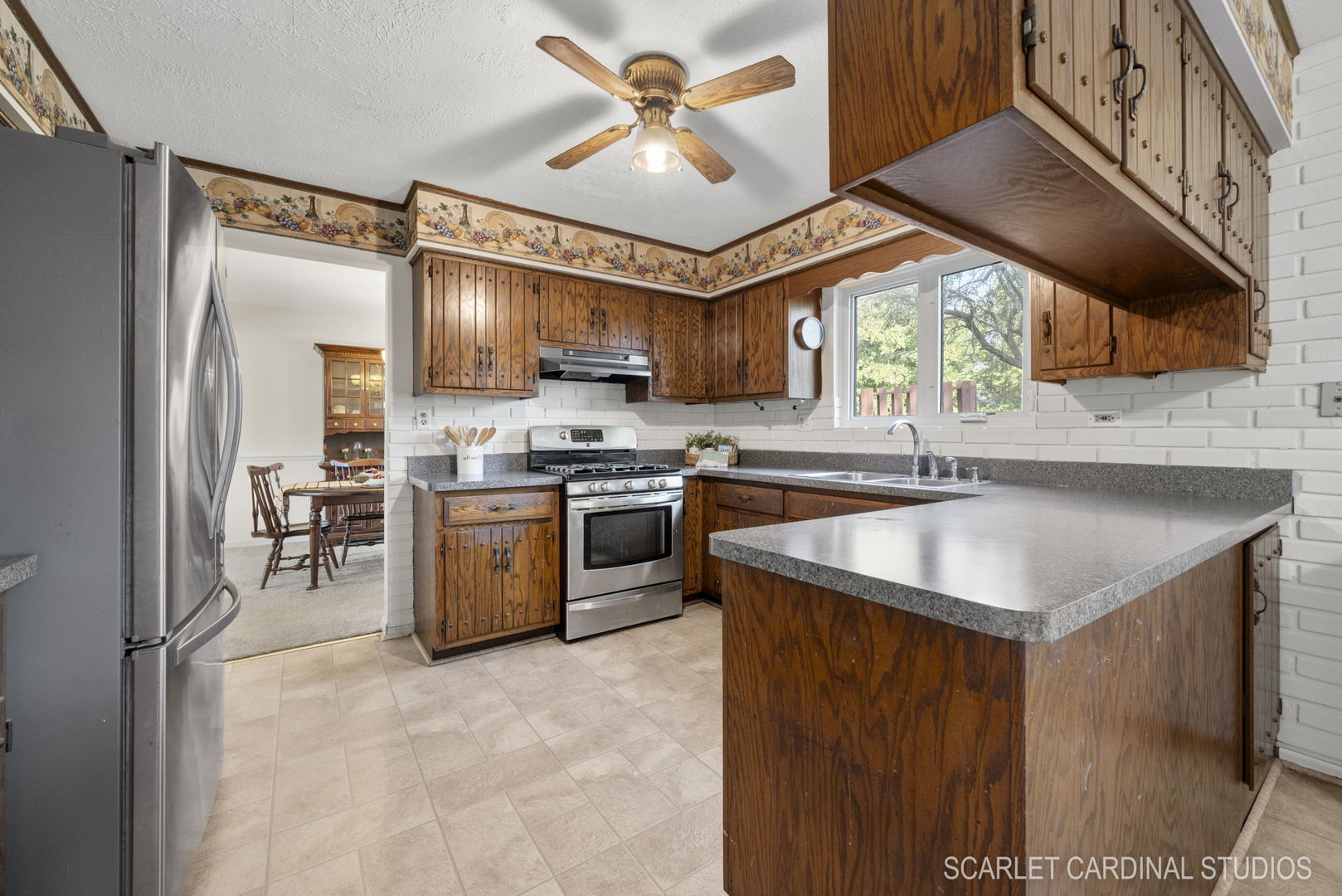 29W206 Wagner Road Naperville, IL 60564 - Photo 7 of 27 a kitchen with stainless steel appliances granite countertop a sink a stove and a refrigerator