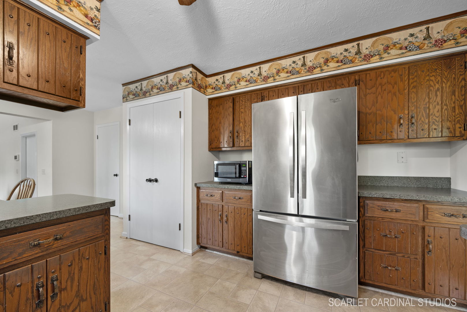 29W206 Wagner Road Naperville, IL 60564 - Photo 8 of 27 a kitchen with stainless steel appliances granite countertop a refrigerator and a stove top oven