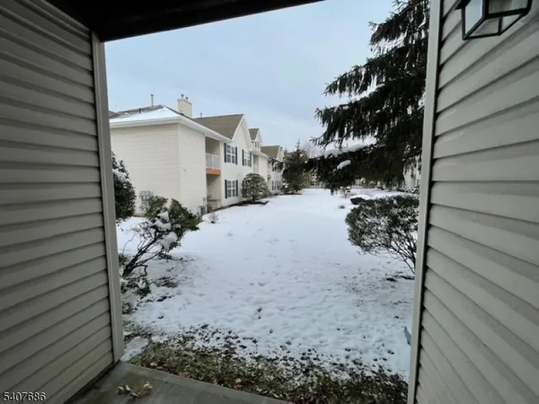 a view of a backyard of the house