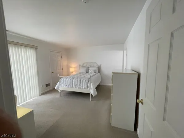 a view of bedroom with furniture and window