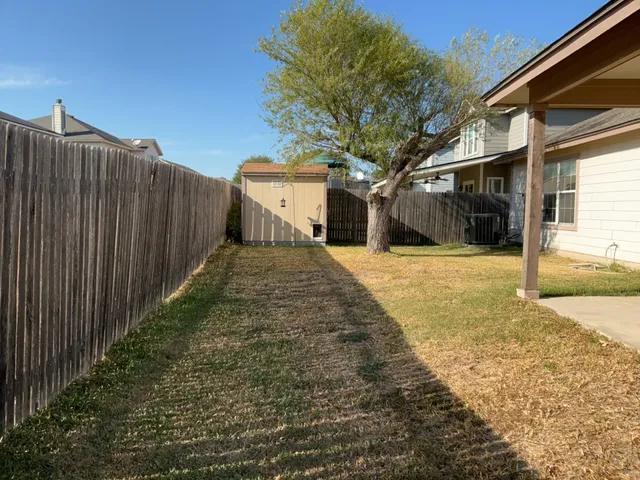 a view of a backyard of the house