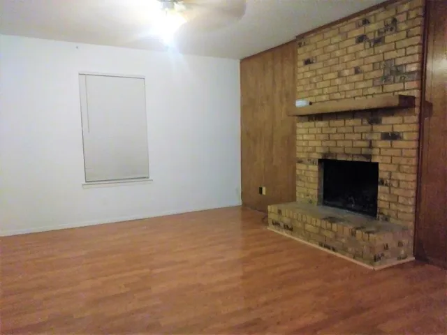 an empty room with a fireplace