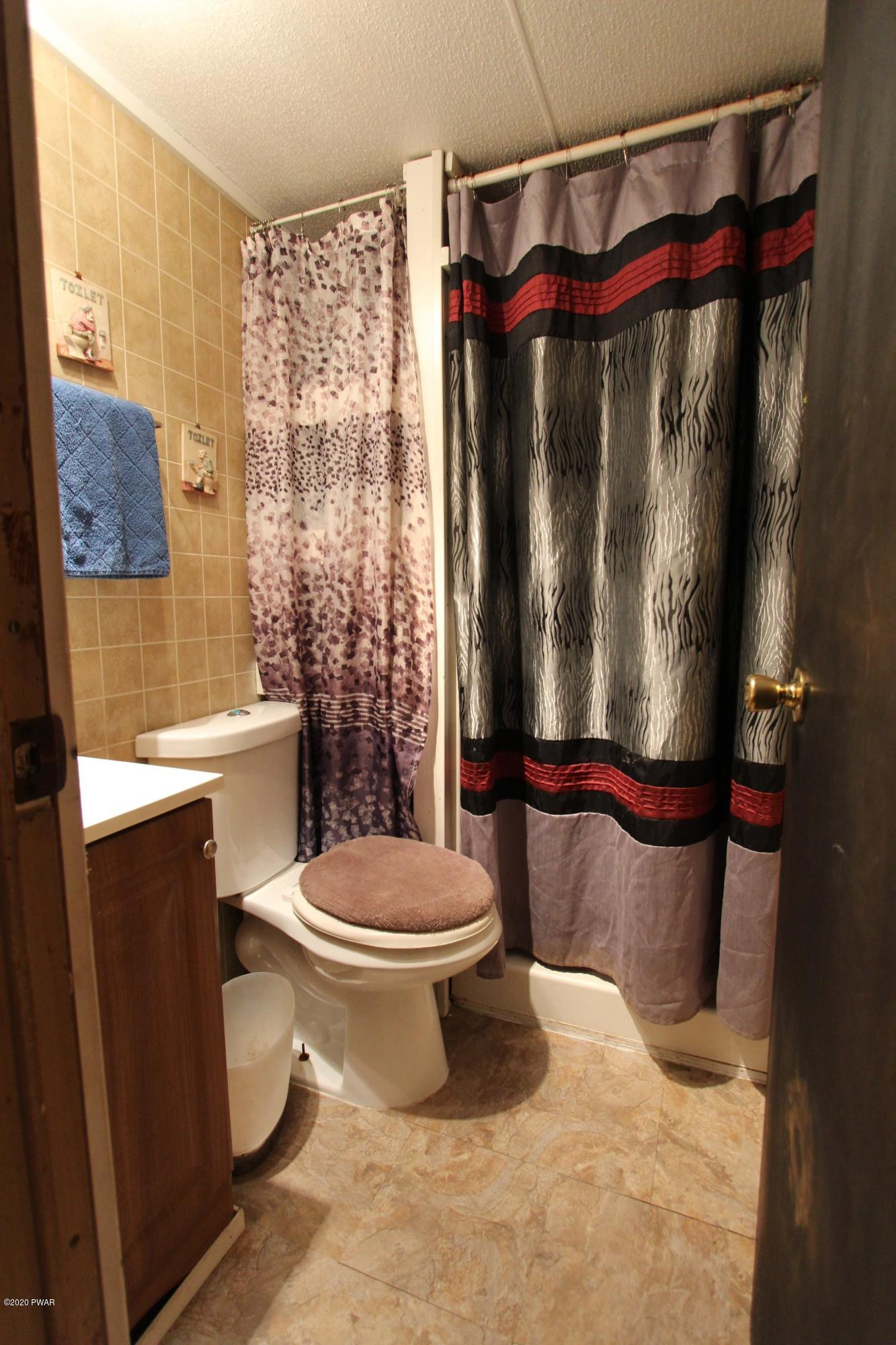 89 Sterling Gardens Road Moscow, PA 18444 - Photo 14 of 22 a bathroom with a toilet and a shower