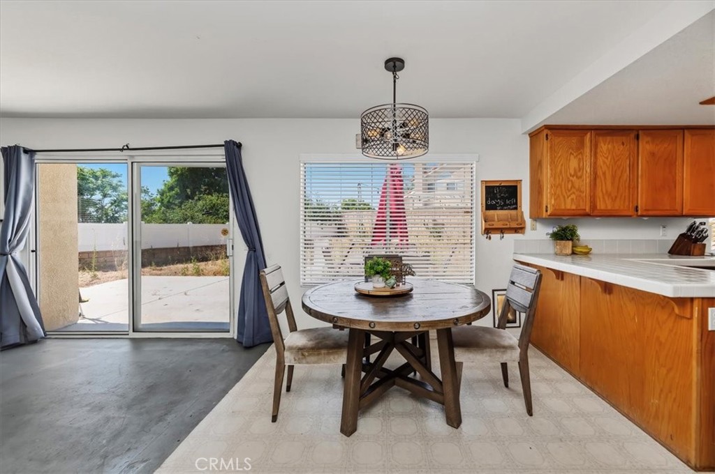352 Leafwood Court Riverside, CA 92506 - Photo 19 of 42 a view of a dining room with furniture window and outside view