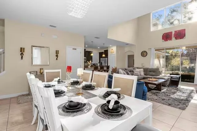 a dining room with furniture a rug and a table