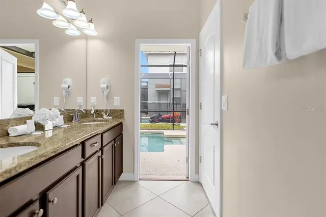 a bedroom with a bed and a chair