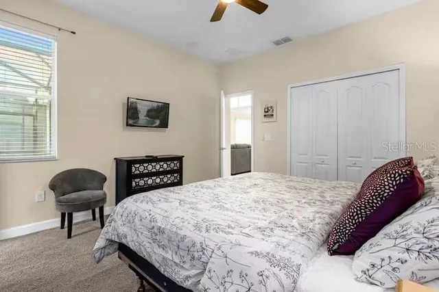 a bedroom with a bed and window