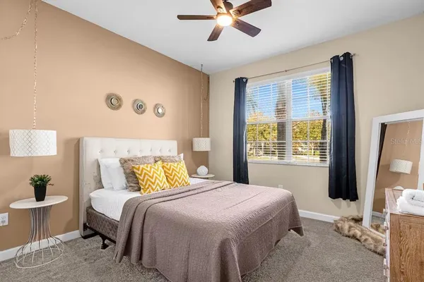 a spacious bathroom with a granite countertop sink a mirror and a shower