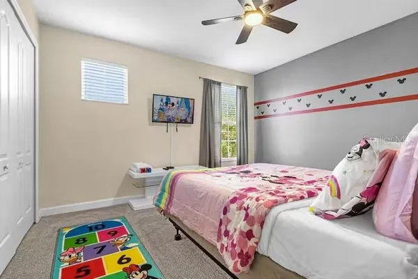 a bedroom with toys and a bed