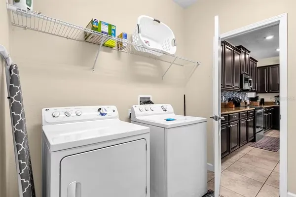 a bedroom with a bed and a lamp