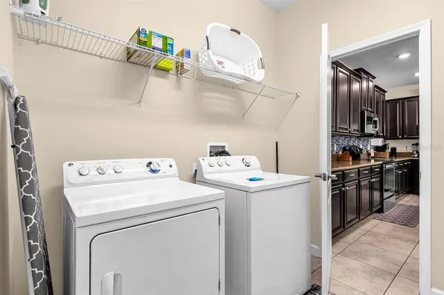 a bedroom with a bed and a lamp