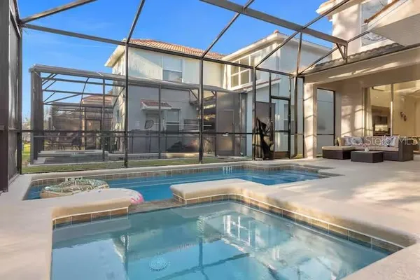 a outdoor space with lots of tables a garden and chairs