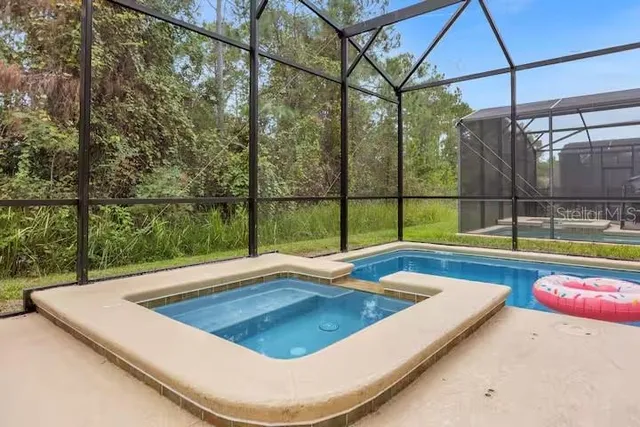 a media room with lots of chairs and a projector screen